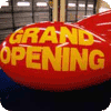 custom advertising blimps with Grand Opening lettering